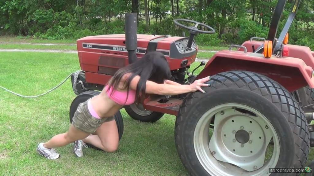 Sexy cowgirl naked on tractor